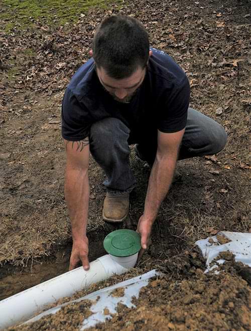 Installing a downspout extension.